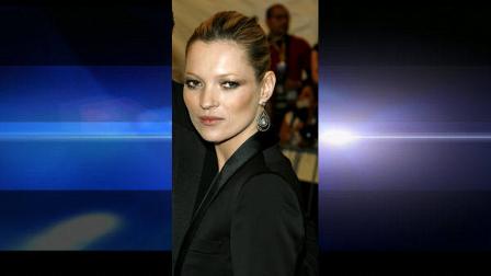 **FILE**Kate Moss arrives at a museum gala in New York on May 1, 2006. Moss, 32, appears in a white lace trench coat at the center of Burberrys main autumn-winter 2006-2007 ad, one in a series launched Monday, June 26, 2006, to celebrate the companys 150th anniversary. The fashion house scrapped a campaign featuring the supermodel last year following tabloid accusations that she had used drugs. (AP Photo/Stuart Ramson)