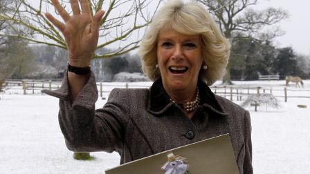 Britains Camilla, Duchess of Cornwall throws a snowball after attending a tea party for children from Ty Hafan hospice in Wales, at Highgrove House in Gloucestershire, England, Monday, Dec. 21, 2009. (AP Photo/Kirsty Wigglesworth, pool)