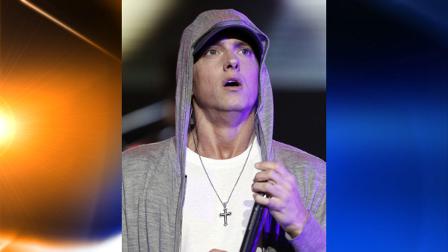 FILE - Rapper Eminem performs at a concert celebrating the launch of the video game DJ Hero in Los Angeles on in this June 1, 2009 file photo. Elton John said Saturday Jan. 2, 2010 he has been helping American rapper Eminen fight drug problems for more than a year. (AP Photo/Matt Sayles, File)