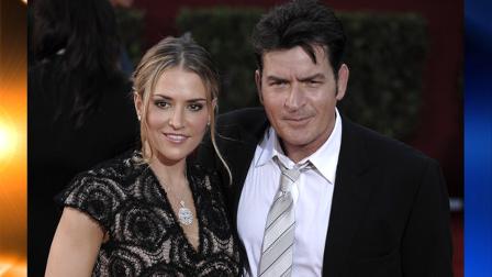 FILE - In this Sept. 20, 2009, file photo, actor Charlie Sheen, right, and his wife Brooke Mueller arrive at the 61st Primetime Emmy Awards in Los Angeles. (AP Photo/Chris Pizzello, file)