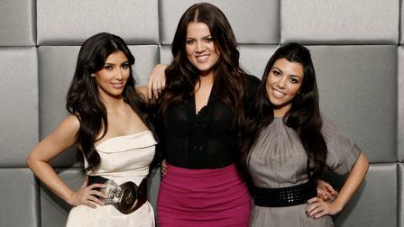 Khloe Kardashian, center, Kim Kardashian, left, and Kourtney Kardashian