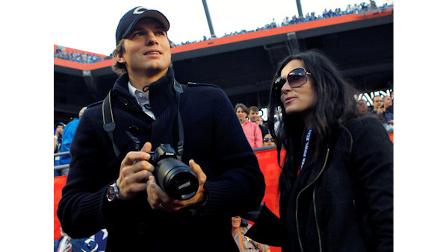 Actor Ashton Kutcher and wife, actress Demi Moore are seen on the sidelines before the NFL Super Bowl XLIV football game between the Indianapolis Colts and New Orleans Saints in Miami, Sunday, Feb. 7, 2010. (AP Photo/Mike Groll)