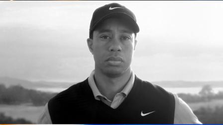 In this image provided by Nike Inc., Tiger Woods appears in a Nike commercial to air starting Wednesday, April 7, 2010 on ESPN. In the stark, black-and-white ad, Woods looks directly into the camera without speaking while a recording of his late father is heard, speaking about taking responsibility. (AP Photo/Nike)
