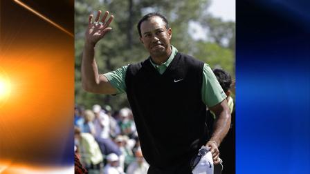Tiger Woods waves to the gallery on the 18th hole after his second round of the Masters golf tournament in Augusta, Ga., Friday, April 9, 2010. (AP Photo/Morry Gash)