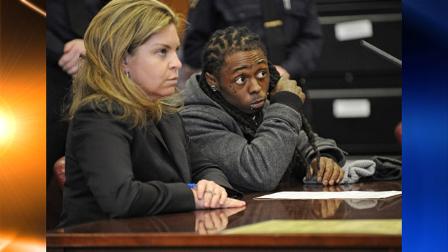 Rapper Lil Wayne listens to the judges sentencing inside the courtroom, with his attorney Stacey Richman by his side at Manhattan criminal court, Monday, March 8, 2010, in New York. Lil Wayne was sentenced Monday to a year in jail for having a loaded gun on his tour bus in 2007. (AP Photo/Louis Lanzano)