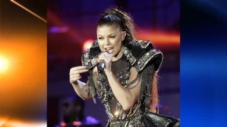US-singer Fergie performs with her band Black Eyed Peas at the opening concert for the soccer World Cup at Orlando stadium in Soweto, South Africa, Thursday, June 10, 2010. The Soccer World Cup kicks off on Friday, June 11. (AP Photo/Gero Breloer)