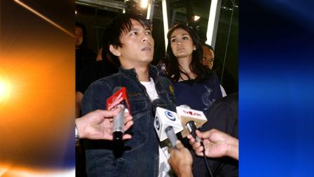 In his July 14, 2009 photo, pop singer Nazril Irham, better known as Ariel, left, and his girlfriend top model and actress Luna Maya, right, are mobbed by reporters in Jakarta, Indonesia. Indonesians grappled with their first-ever celebrity sex tape scandal in June 2010, casting aside social taboos as they swarmed around office computers and mobile phones to watch explicit clips allegedly showing the popular singer having sex with his girlfriend and another one with his equally famous ex-girlfriend Cut Tari. (AP Photo)