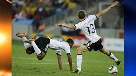 Germanys Cacau, left, stumbles as his teammate Thomas Mueller tries to control the ball during the World Cup group D soccer match between Germany and Australia at the stadium in Durban, South Africa, Sunday, June 13, 2010. (AP Photo/ddp, Oliver Lang)