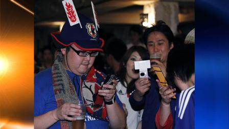 In this June 15, 2010 photo, Japanese football supporters tweet their reaction with their mobile phones soon after Cameroon scored a goal against Japan during a special event for Twitter fans to watch a live broadcast of a Group E match at the 2010 FIFA World Cup in South Africa, at a restaurant in Tokyo. (AP Photo/Shizuo Kambayashi)
