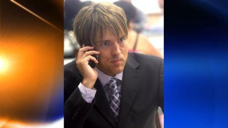 Larry Birkhead talks on his cell phone at the Los Angeles Courthouse prior to taking the stand as a witness in the Anna Nicole Smith trial in Los Angeles on Thursday, Aug. 19, 2010. (AP Photo/Nick Ut)