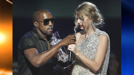 FILE - In this Sept. 13, 2009 file photo, singer Kanye West takes the microphone from singer Taylor Swift as she accepts the Best Female Video award during the MTV Video Music Awards in New York. West is still feeling the pain over his trophy grab from Taylor Swift last year, and hes expressing his pain all over Twitter. West has unleashed a torrent of emotions on his official Twitter on Saturday, Sept. 4, 2010, acknowledging he was wrong for taking an award from the country sweetheart at the MTV Video Music Awards. But he says he bled hard. He says he had to cancel his tour with Lady Gaga and even lost employees. (AP Photo/Jason DeCrow, File)