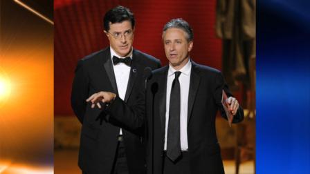 FILE - In this Sept. 21, 2008 file photo, Stephen Colbert, left, and Jon Stewart make an award presentation at the 60th Primetime Emmy Awards in Los Angeles. (AP Photo/Mark J. Terrill, file)