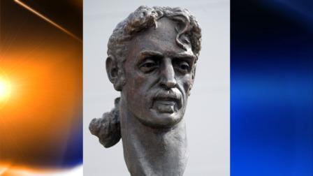 A statue of musician Frank Zappa stands outside a library in Baltimore, the city where Zappa was born, Sunday, Sept. 19, 2010. The statue was donated to the city by ZAPPART, a Lithuanian nonprofit organization. (AP Photo/Steve Ruark)