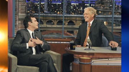 In this photo released by CBS, actor Joaquin Phoenix, left, gestures to host David Letterman on the set of the Late Show with David Letterman, Wednesday, Sept. 22, 2010, in New York. This is Phoenixs first television appearance and first visit to the CBS broadcast since February 2009. (AP Photo/CBS, Jeffrey R. Staab)