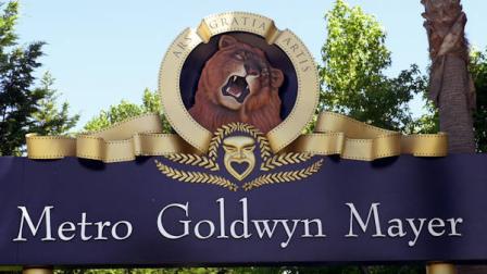 ** FILE** The Metro-Goldwyn-Mayer logo graces the entrance gates at their Santa Monica, Calif., offices July 23, 2002. A bidding war has broken out for Metro-Goldwyn-Mayer, with Time Warner Inc. making a nearly $5 billion offer for the venerable Hollywood studio, according to newspaper reports Thursday, July 1, 2004. Sony Corp. has also tendered an offer to purchase Metro-Goldwyn-Mayer. (AP Photo/Nick Ut)