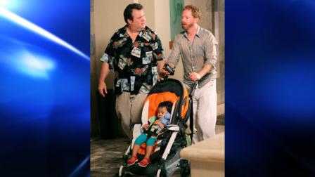 In this publicity image released by ABC, Eric Stonestreet, left and Jesse Tyler Ferguson are shown in a scene from Modern Family. (AP Photo/ABC, Mario Perez)