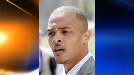 FILE - Rapper T.I. whose real name is Clifford Harris speaks to reporters outside the Richard B. Russell Federal Courthouse in Atlanta, in this March 27, 2008 file photo. (AP Photo/John Bazemore, File)
