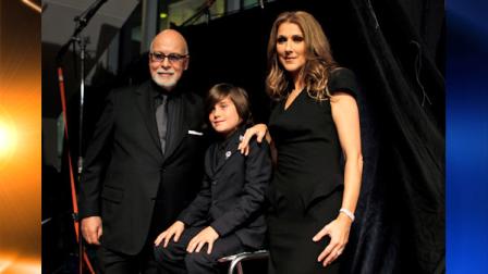 Celine Dion, right, poses with her husband Rene Angelil, left, and son Rene Charles Angelil, center, as they arrive for the premiere of the film Celine: Through the Eyes of the World in Miami Beach, Fla. Tuesday, Feb. 16, 2010. (AP Photo/Lynne Sladky)