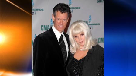 FILE - In this Nov. 12, 2008 file photo, country singer Randy Travis and his wife Elizabeth arrive at the 42nd Annual CMA Awards in Nashville, Tenn. (AP Photo/Peter Kramer, file)