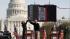 Comedian Stephen Colbert, left, leaps to...