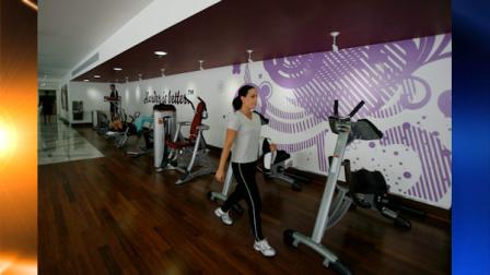 A woman walks through Hard Candy Fitness before its opening in Mexico City, Sunday Nov. 28, 2010. Madonna will attend the opening of her new gym in Mexico City on Monday. (AP Photo/Miguel Tovar)