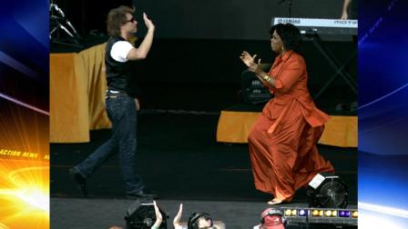 American talk show host Oprah Winfrey, right, walks towards singer Jon Bon Jovi during the filming of Oprahs Ultimate Australian Adventure at the Sydney Opera House in Sydney, Australia, Tuesday, Dec 14, 2010. (AP Photo/Jeremy Piper)