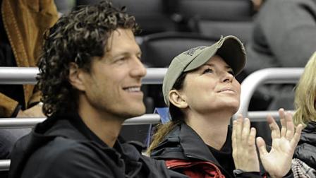 In this Nov. 6, 2010 file photo, singer Shania Twain sits with Frederic Thiebaud, left, during the third period of an NHL hockey game between the Nashville Predators and the Los Angeles Kings in Los Angeles. Twains manager Jason Owen confirmed Monday, Dec. 20, 2010, that Twain is engaged to business executive Frederic Thiebaud.