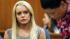 Lindsay Lohan, left, looks on as her attorney,...