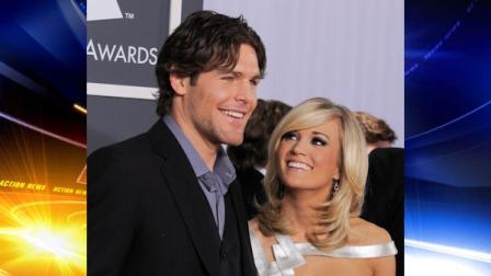 FILE - Carrie Underwood and Ottawa Senators hockey player Mike Fisher arrive at the Grammy Awards in this Jan. 31, 2010 file photo taken in Los Angeles. The Senators are sending Fisher to the Nashville Predators for a first-round draft pick and a conditional pick. Fisher, who is married to country music star Carrie Underwood, has 24 points this season. (AP Photo/Chris Pizzello, File)