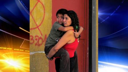 A woman holds a child as they stand outside a building as a precaution after a magnitude-6.8 earthquake in Concepcion, Chile, Friday Feb. 11, 2011. The earthquake struck central Chile Friday, centered in almost exactly the same spot where last years magnitude-8.8 quake spawned a tsunami and devastated coastal communities. Electricity and phone service were disrupted and thousands of people fled to higher ground following Fridays quake, but the government quickly announced that there was no risk of a tsunami, and there were no reports of damage or injuries. (AP Photo/Francisco Negroni)
