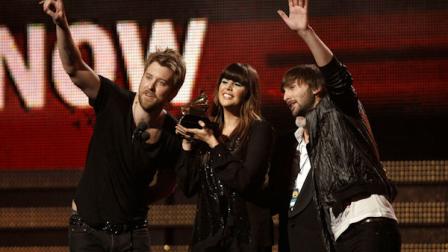 Lady Antebellum, from left, Charles Kelley, Hilary Scott, and Dave Haywood accept the award for best country album at the 53rd annual Grammy Awards on Sunday, Feb. 13, 2011, in Los Angeles. (AP Photo/Matt Sayles)
