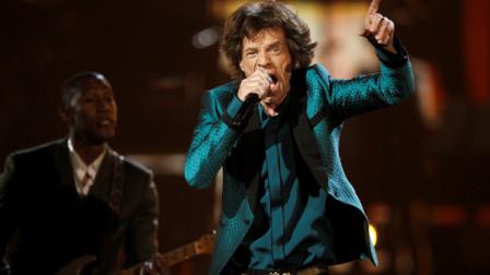 From left, Raphael Saadiq and Mick Jagger perform at the 53rd annual Grammy Awards on Sunday, Feb. 13, 2011, in Los Angeles. (AP Photo/Matt Sayles)