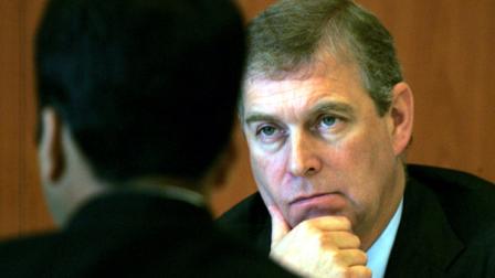 FILE - In this Monday, Oct. 30, 2006 file photo Prince Andrew, The Duke of York and U.K. Special Representative for International Trade and Investment, gestures during a luncheon session in his honor, organized by Indian Chambers of Commerce and Industries in New Delhi, India. As Buckingham Palace prepares to celebrate the wedding of Prince William, officials are rushing to contain a flurry of negative publicity from the side of the family that has long been a cause embarrassment. Prince Andrew, the queens second son, is friends with a convicted sex offender _ pictures have been published of him with his arm around the waist of the teenage prostitute at the center of that case _ and his hosting of the son of the Tunisian dictator, shortly before a popular uprising drove him from power, has led to calls for him to be stripped of his role as special UK trade ambassador.(AP Photo/Manish Swarup)