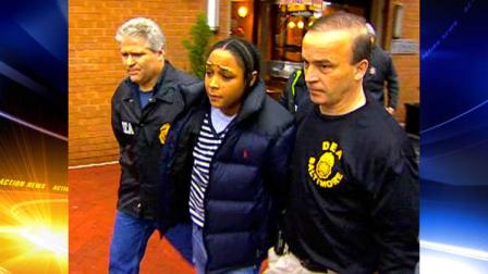 In this frame grab from video released by WBAL-TV 11, Drug Enforcement Administration agents escort Felicia Snoop Pearson, who played a killer of the same name on the hit HBO series The Wire, as she was among dozens arrested in an early morning drug raid, Thursday, March 10, 2011, in Baltimore. (AP Photo/WBAL-TV 11)