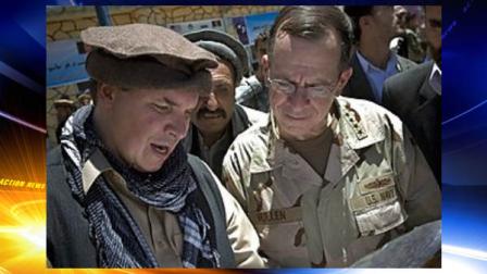 FILE - In this July 15, 2009 file photo released by Department of Defense, Three Cups of Tea co-author Greg Mortenson shows the locations of future village schools to U.S. Navy Adm. Mike Mullen, chairman of the Joint Chiefs of Staff, at the opening of Pushghar Village Girls School 60 miles north of Kabul in Panjshir Valley, Afghanistan. Montanas attorney general on Tuesday, April 19, 2011 told The Associated Press that he has launched an inquiry into the charity run by Mortenson, following investigations by 60 Minutes and author Jon Krakauer into inaccuracies in the book. (AP Photo/Department of Defense, U.S. Navy Petty Officer 1st Class Chad J. McNeeley)
