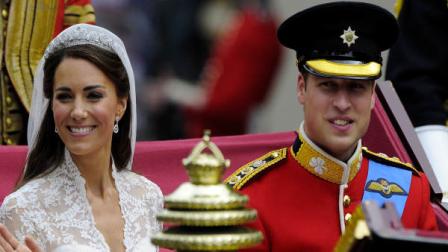 Britains Prince William and Catherine, Duchess of Cambridge travel to Buckingham Palace in the 1902 State Landau, along the Procession Route, after their wedding in Westminster Abbey, in central London April 29, 2011. Prince William married his fiancee, Kate Middleton, in Westminster Abbey on Friday April 29, 2011. (AP Photo/Paul Hackett, Pool)