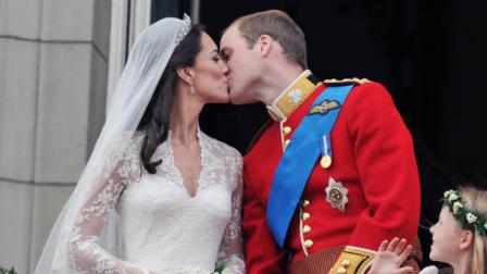 Prince William and his wife Kate Middleton, who has been given the title of The Duchess of Cambridge, kiss on the balcony of Buckingham Palace, London, following their wedding at Westminster Abbey on Friday April 29, 2011. (AP Photo/John Stillwell, Pool)
