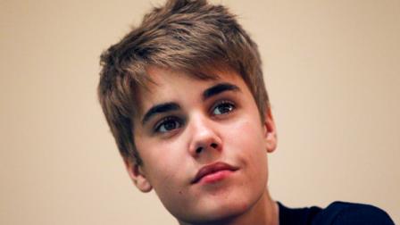 FILE - In this April 19, 2011 file photo, pop star Justin Bieber gives a press conference in Singapore. Teen pop singer Justin Bieber has agreed to record a public service announcement on cyberbullying in order to resolve misdemeanor charges filed against one of his managers and a record executive after a frenzy at a Long Island mall. (AP Photo/Wong Maye-E, File)