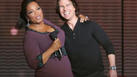 Tom Cruise, right, appears with Oprah Winfrey during a star-studded double-taping of Surprise Oprah! A Farewell Spectacular, Tuesday, May 17, 2011, in Chicago. The Oprah Winfrey Show is ending its run May 25, after 25 years, and millions of her fans around the globe are waiting to see how she will close out a show that spawned a media empire. (AP Photo/Charles Rex Arbogast)