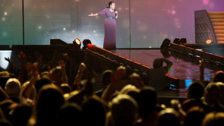 Oprah Winfrey acknowledges fans during a star-studded double-taping of Surprise Oprah! A Farewell Spectacular, Tuesday, May 17, 2011, in Chicago. The Oprah Winfrey Show is ending its run May 25, after 25 years, and millions of her fans around the globe are waiting to see how she will close out a show that spawned a media empire. (AP Photo/Charles Rex Arbogast)