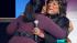 Singer Patti LaBelle, right, hugs Oprah Winfrey...