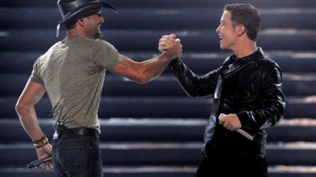 Tim McGraw, left, and finalist Scotty McCreery perform at the American Idol finale on Wednesday, May 25, 2011, in Los Angeles. (AP Photo/Chris Pizzello)