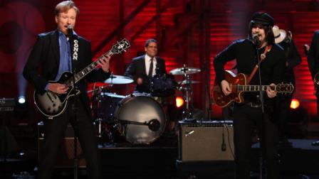 In this publicity image released by Team Coco, Conan OBrien, left, and Jack White perform on the debut of Conan, Monday, Nov. 8, 2010 in Burbank, Calif. Stephen Colbert and Jack White are cutting a record together. On Wednesday, June 22, 2011, White agreed to produce a song for Colbert through his record label, the Nashville-based Third Man Records. White said he would pair Colbert with a Third Man act, the goth girl rock band Black Belles. They are to perform on The Colbert Report, on Thursday. This is Whites second collaboration with a late-night talk show host. He last year released a live rockabilly album with Conan OBrien. (AP Photo/Team Coco, Meghan Sinclair)
