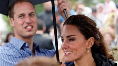 Prince William and his wife Kate, the Duke and Duchess of Cambridge, greet spectators in the rain in Dalvay-by-the-Sea on Prince Edward Island as part of their Royal Tour of Canada, Monday, July 4, 2011.