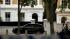 olice officers are seen outside the home of...