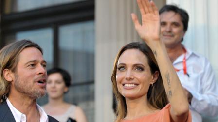 Angelina Jolie and Bred Pitt arrive on the red carpet during the final night of the 17th Sarajevo film festival in Sarajevo in Sarajevo, Bosnia, on Saturday, July 30,2011. Angelina Jolie and Brad Pitt have arrived in Bosnias capital to take part in the closing ceremony of the eight-day Sarajevo Film Festival. Festival organizers said Saturday the actress will be receiving a special award during the surprise visit. Jolie visited Bosnia last year several times as UNHCR ambassador and drew attention to the plight of 117,000 people who havent able to return to their homes even though the Bosnia war ended 15 years ago.(AP Photo/STR)
