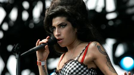 Amy Winehouse performs at Lollapalooza at Grant Park in Chicago on Sunday, Aug. 5, 2007. The three-day festival, headlined by Pearl Jam, includes 130 bands. (AP Photo/Brian Kersey)