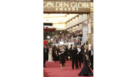 In this Jan. 11, 2009 file photo, celebrities arrive at the 66th Annual Golden Globe Awards in Beverly Hills, Calif. Attorneys for the organizers of the glitzy awards show and producers will try to convince a federal judge this week that each has the authority to negotiate broadcast rights. A deal to keep the show on NBC through 2018 hangs in the balance. (AP Photo/Matt Sayles, File)