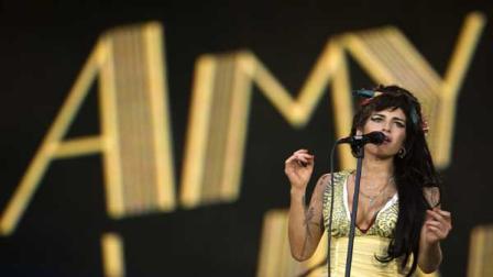 In this July 4, 2008 file photo, singer Amy Winehouse of England performs during the Rock in Rio music festival in Arganda del Rey, on the outskirts of Madrid. Amy Winehouse was found dead at her home in London on Saturday, July 23, 2011. The singer was 27 years old. (AP Photo/Victor R. Caivano, File)
