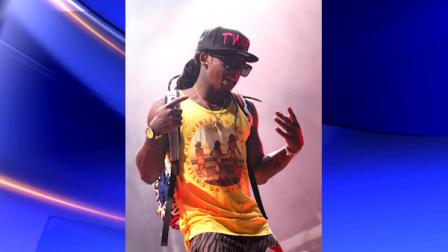 FILE - In this June 11, 2011 file photo, Lil Wayne performs during the Bonnaroo Music and Arts Festival in Manchester, Tenn. Lil Wayne said Monday, Aug. 22, 2011, he is recovering after gashing his head at a St. Louis-area skateboard park. The 28-year-old rapper whose real name is Dwayne Michael Carter Jr. was in suburban St. Louis Sunday for a performance at the outdoor Verizon Amphitheatre. (AP Photo/Dave Martin, file)